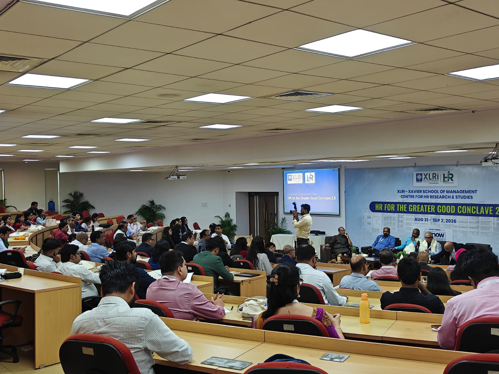 Panel discussion underway at HR for the Greater Good Conclave 2.0 with working professionals seated in the XLRI lecture hall